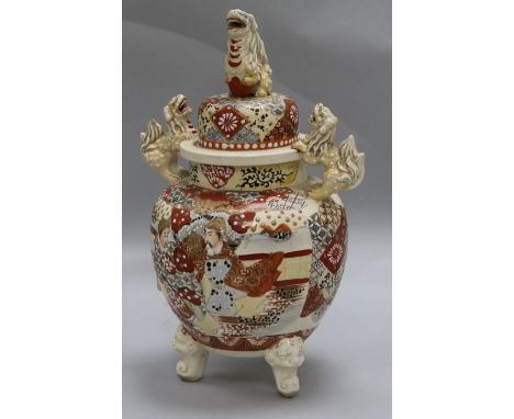 A Japanese Satsuma koro, the domed cover with shishi finial, decorated with figures, H.15.25in (38.75cm)