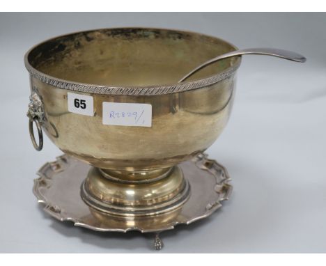 A silver plated bowl, ladle and stand