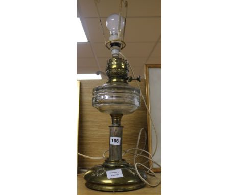 A Victorian brass and glass oil lamp