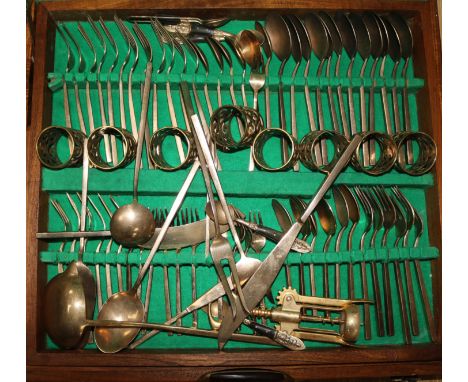 A bronze canteen of cutlery, in leather case