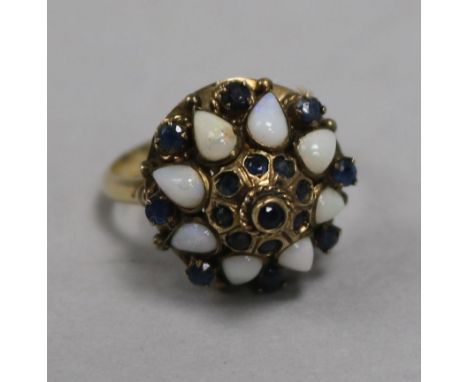 An 18ct gold, opal and sapphire cluster ring, size P.