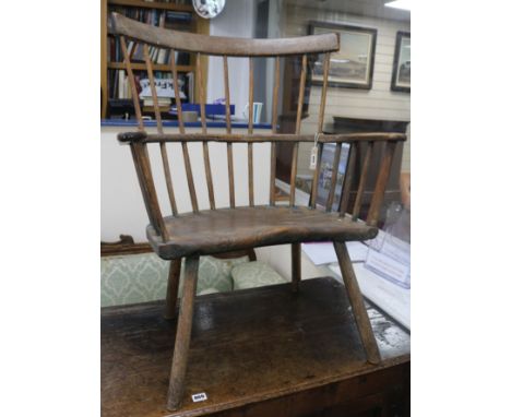 An elm comb and stick back open arm elbow chair