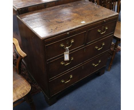 A Georgian oak caddy-top four-drawer chest, fitted brushing slide, on bracket feet, W.76cm