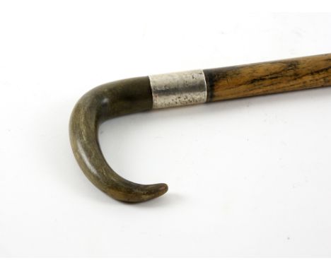 Early 20th century rhino horn handled and white metal mounted walking stick, 84cm long, .    