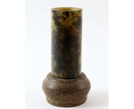 Chinese green and black mottled carved jade cylinder set in a bamboo base, 14cm high,.    