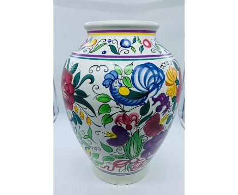 A Poole Pottery vase in the bluebird design
