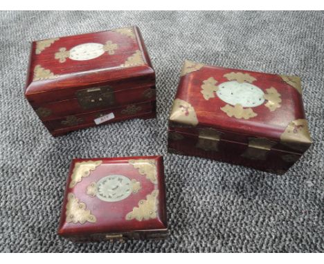A selection of oriental jewellery cases having carved Jade style panels to top
