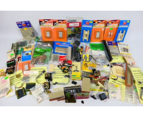 Peco - Hornby - Gilbow - Springside - Unsold Shop Stock - A quantity of bagged railway accessories in various scales includin