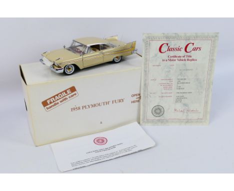 Danbury Mint - A boxed 1:24 scale die-cast 1958 Plymouth Fury by Danbury Mint - Model comes in original postage box and and i