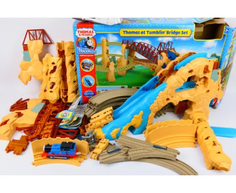 Tomy - A boxed Thomas at Tumblin' Bridge set - Set comes with track, Thomas The Tank Engine train, and bridge. Box appears po