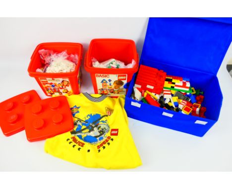 Lego - Children's Jumper - Loose lego. A light fabric box containing 3.10 KG of lego and a small children's jumper. Items app
