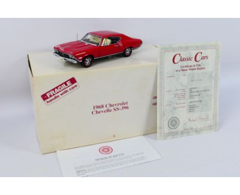 Danbury Mint - A boxed 1:24 scale die-cast 1968 Chevrolet Chevelle SS-396 by Danbury Mint - Model comes in original postage b