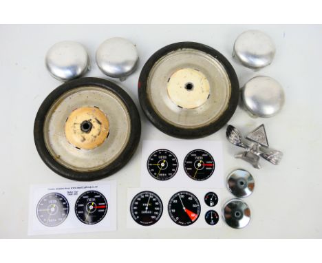 Tri-ang -  A collection of Tri-ang pedal car restoration parts, 2 x original 7" wheels with tyres, 4 x reproduction 3" hub ca