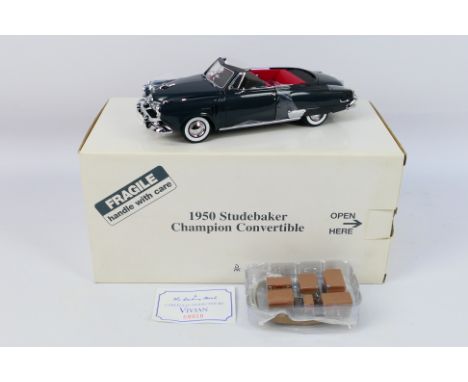 Danbury Mint - A boxed 1:24 scale die-cast 1950 Studebaker Champion Convertible by Danbury Mint - Model comes in original pos