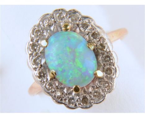 AN OPAL AND DIAMOND CLUSTER RING, IN GOLD, UNMARKED, HEAD 12 X 16MM, 3.4G SIZE L  Opal polish dull from wear. Diamonds clean 