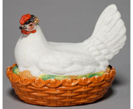 A CONTINENTAL EARTHENWARE HEN AND NEST EGG BOX AND COVER, C1870, THE SITTING BIRD IN WHITE EGGSHELL GLAZE SAVE FOR THE HEAD, 