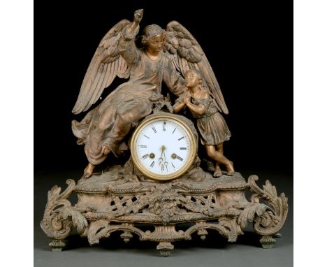 A LATE 19TH C SPELTER&nbsp; MANTEL CLOCK, THE DRUM SHAPED CASE WITH WINGED ANGEL AND INFANT, STANDING ON A RUSTIC BASE, THE W