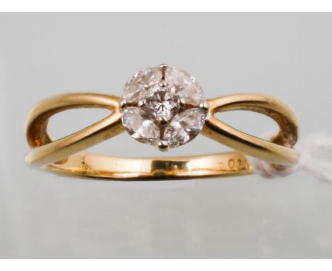 A DIAMOND CLUSTER RING WITH ONE ROUND AND FOUR NAVETTE DIAMONDS, GOLD HOOP WITH PIERCED SHOULDERS MARKED 750, SIZE M  Good co