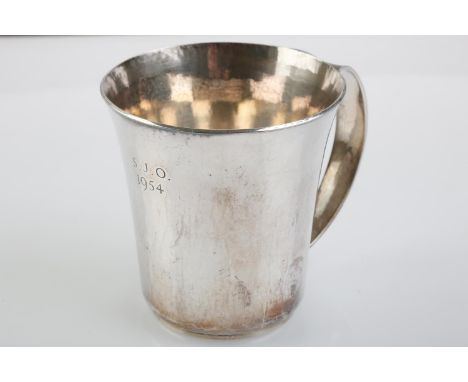 LESLIE DURBIN. AN ARTS AND CRAFTS SILVER CHILD'S MUG, FLARED CYLINDRICAL WITH TAPERING HANDLE, ENGRAVED WITH INITIALS S.J.O. 