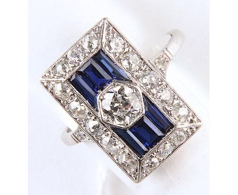 AN ART DECO DIAMOND AND SYNTHETIC SAPPHIRE RECTANGULAR CLUSTER RING, WITH CALIBRE AND OLD CUT STONES, MILLEGRAIN SET, THE LAR