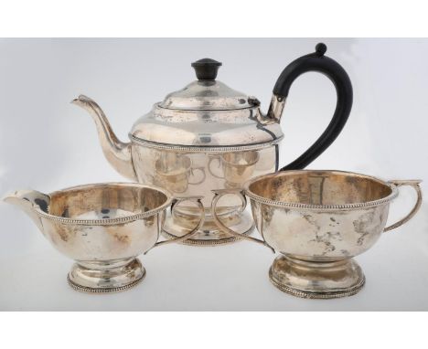 A GEORGE VI SILVER TEA SERVICE OF URNULAR FORM WITH BEADED RIM, TEAPOT 15.5CM H, BY A L DAVENPORT LIMITED, BIRMINGHAM 1938, 1