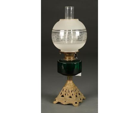 A VICTORIAN GREEN GLASS AND BRASS OIL LAMP,&nbsp; 55CM H, WITH PIERCED GILT IRON FOOT, DRUM SHAPED RESERVOIR, FROSTED GLASS S