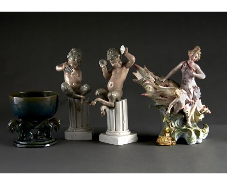 A PAIR OF SPANISH PORCELAIN FIGURES OF FAWNS SEATED ON COLUMNS, A CONTINENTAL PORCELAIN FIGURE OF A GIRL SEATED ON A CONCHE S