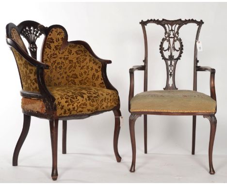 A MAHOGANY ELBOW CHAIR IN CHIPPENDALE STYLE, C1890, THE PIERCED BACK WITH SCROLL CARVED TOP RAIL AND PIERCED LEAF AND SCROLL 