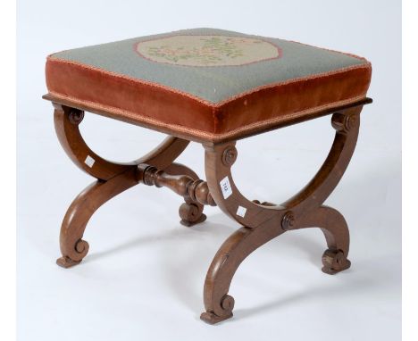 A VICTORIAN ROSEWOOD X-FRAME STOOL, C1850, THE SQUARE TOP UPHOLSTERED IN FLORAL GROS POINT, THE X-SHAPED FRAME WITH APPLIED D