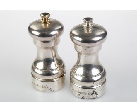 A GRADUATED PAIR OF ELIZABETH II SILVER SALT AND PEPPER MILLS, 10 AND 10.5CM H, BY A J POOLE, BIRMINGHAM 2001  Good second ha