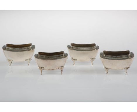 A SET OF FOUR EDWARDIAN OBLONG SILVER SALT CELLARS ON FOUR FEET, 51MM L, BY H MATTHEWS, BIRMINGHAM 1909, 4OZS 12DWTS  Light w