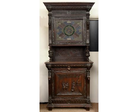 A NORTHERN EUROPEAN CARVED AND DARK STAINED OAK SIDE CABINET, FLANDERS, C1870, CARVED AND APPLIED WITH GROTESQUES AND DEMI FI