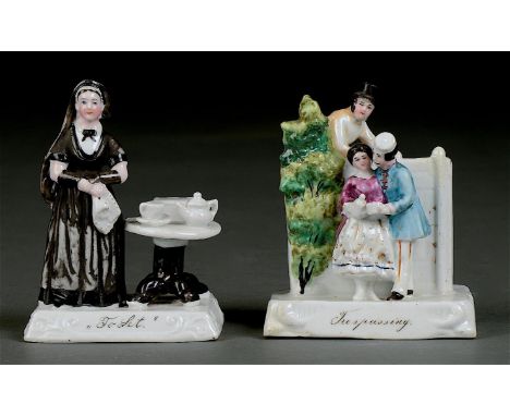 "TRESPASSING" AND "TO LET". TWO GERMAN PORCELAIN FAIRINGS, C1860-75, THE BASE GLAZED OR UNGLAZED, 10CM H, THE FIRST INCISED 2