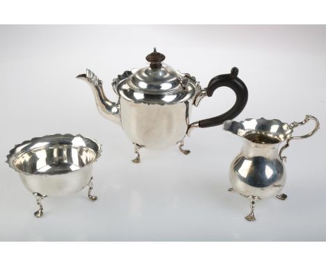 AN EDWARDIAN SILVER BACHELOR'S TEA SERVICE ON THREE HOOF FEET, TEAPOT 11.5CM H, BY MAPPIN AND WEBB LIMITED, LONDON 1902 AND 0