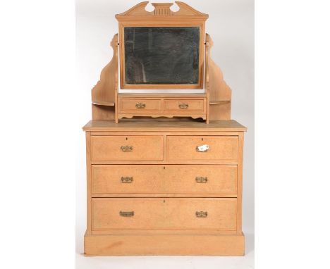 A LATE VICTORIAN OAK AND AMBOYNA VENEERED DRESSING TABLE, THE RECTANGULAR BEVELLED PLATE BENEATH A BROKEN PEDIMENT AND SUPER 