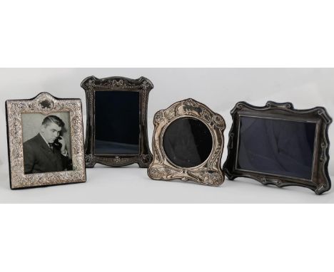 FOUR ELIZABETH II SILVER PHOTOGRAPH FRAMES, IN VICTORIAN OR ART NOUVEAU STYLE, VARIOUS SIZES, ONE 18 X 14CM  Good condition