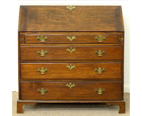 A GEORGE III OAK BUREAU, EARLY 19TH C, THE DRAWERS AND DOOR TO THE INTERIOR WITH CHEVRON OR BROKEN LINE INLAY, ON BRACKET FEE