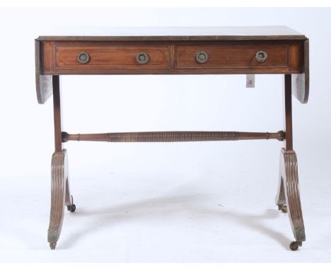 A GEORGE IV MAHOGANY SOFA TABLE, THE TOP FITTED WITH TWO DRAWES AND OPPOSING DUMMY DRAWERS, ON PLAIN STANDARDS, HOLLOW FLUTED