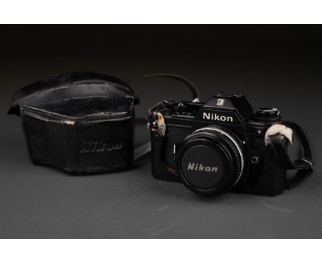 A NIKON EM 35MM SLR CAMERA, WITH NIKON FI.8 50MM SERIES E LENS, LEATHER CASE From a deceased estate and in good second hand w