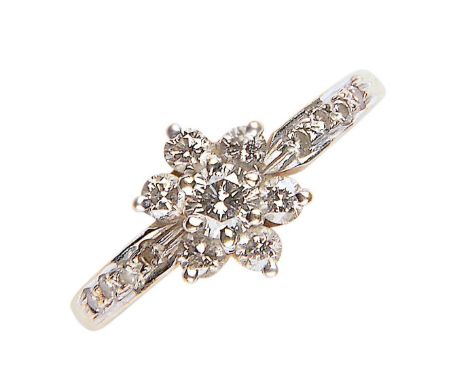 A DIAMOND STAR CLUSTER RING WITH DIAMOND SHOULDERS, IN GOLD MARKED 750, 1.4G, SIZE L  Good condition