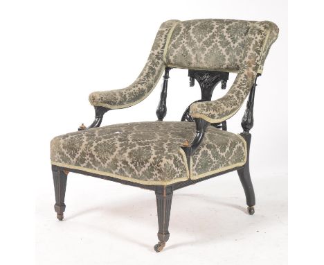 AN AESTHETIC MOVEMENT UPHOLSTERED ARMCHAIR, C1885, THE STUFFED OVER BACK, ARM PADS AND SEAT IN BLUE GREY MOQUETTE, EBONISED S