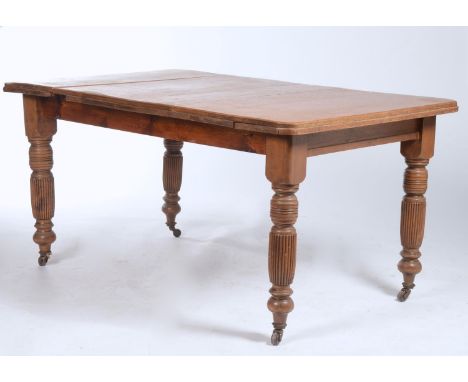 A LATE VICTORIAN OAK TOPPED DINING TABLE ON PINE FLUTED TURNED LEGS, FITTED CERAMIC CASTORS, 152 X 96CM  Top cracked and join