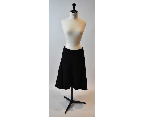 CELINE; a black 100% wool A-line skirt, size 38.