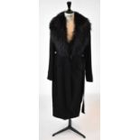 ELIE SAAB; a black wool mix full length coat with fox fur collar, size 36.