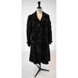 A dark brown full length fur coat, size 36.