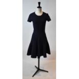ALAIA; a navy blue wool mix short sleeve flared dress, size 36.