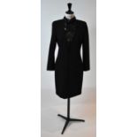EMILIO PUCCI; a black 100% wool cocktail dress with beads and sequins, size small.