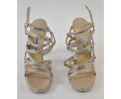 JIMMY CHOO; a pair of gold satin and diamante stiletto healed sandals, heal 13cm, size 39.