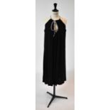 AZZARO; a black evening dress with diamante bow to collar, size 38.