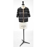 CHLOE; a grey short sleeved cropped jacket with bead embellishment, size T36.